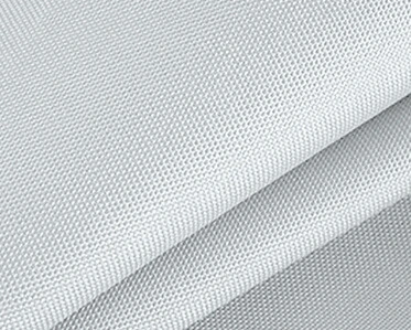 Close-up of folded light gray textured fabric with a fine, woven pattern, showing the detailed surface and overlapping layers.