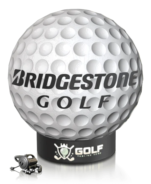 A large golf ball with Bridgestone Golf text stands on a black base with a golf-themed logo. Small engine parts are placed next to the base.